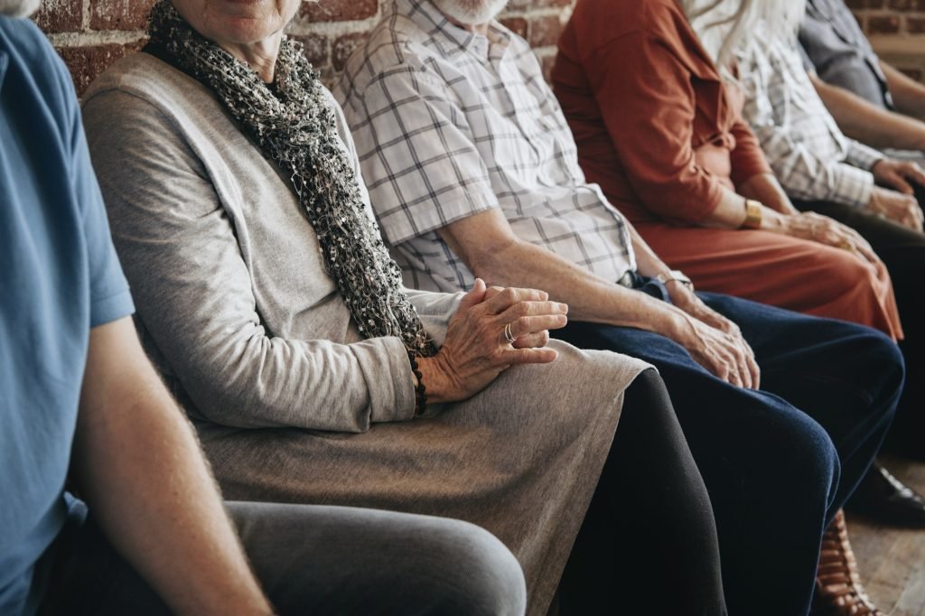 Group of elderly people sitting in a row