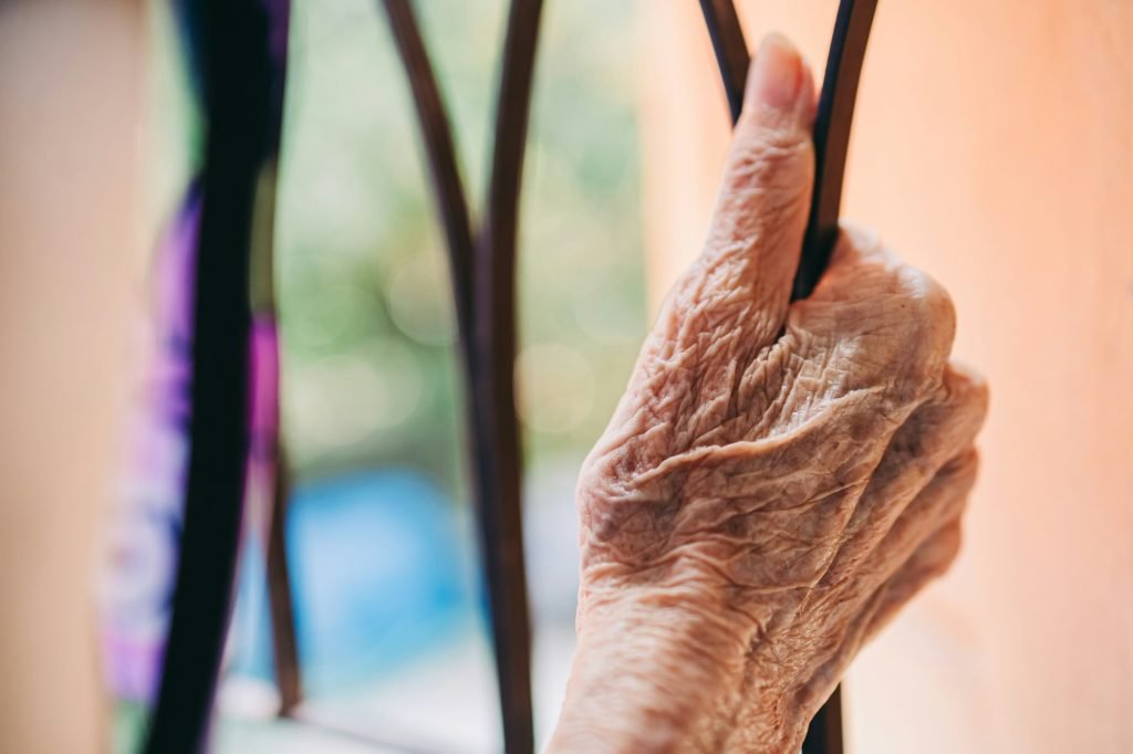 Hand of elderly people with wrinkles of aging